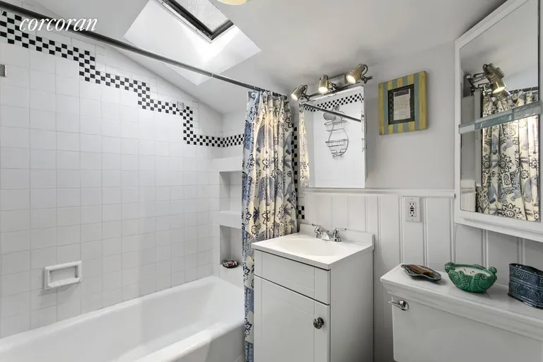 New York City Real Estate | View 19 7th Avenue, 4 | Updated bathroom w/ skylight | View 5