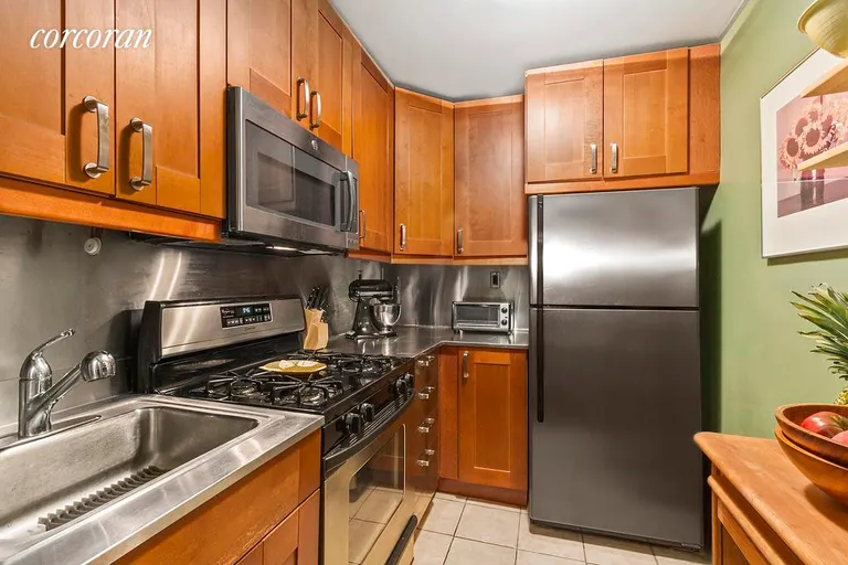 New York City Real Estate | View 2 King Street, 1D | Sizable kitchen with plenty of cabinet space. | View 4