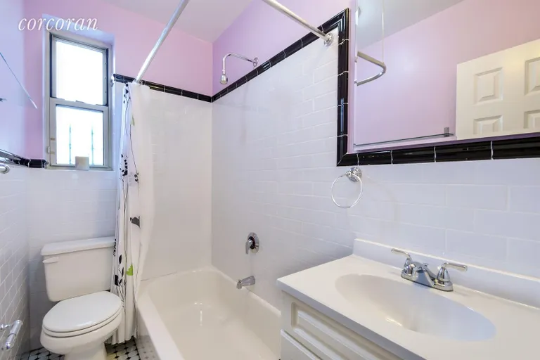 New York City Real Estate | View 9281 Shore Road, 307 | Tasteful and Windowed Hall Bathroom | View 7