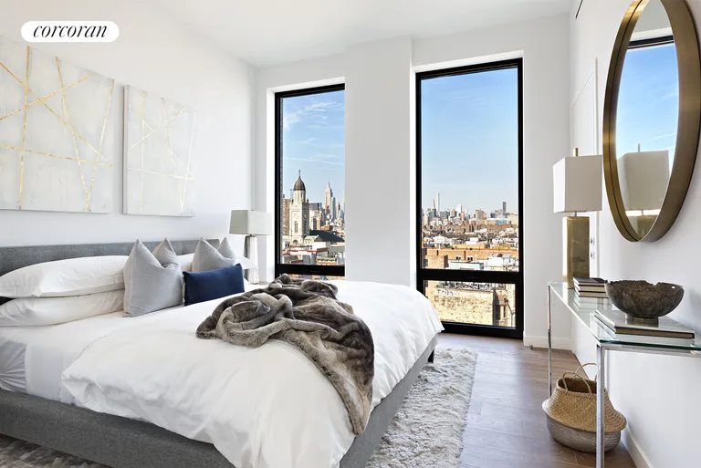 New York City Real Estate | View 287 East Houston Street, 9B | Master bedroom with midtown skyline views | View 5
