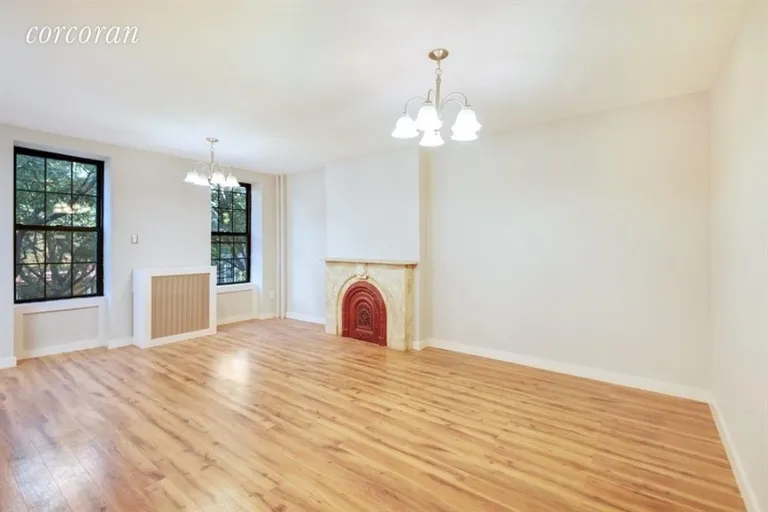 New York City Real Estate | View 379 Gates Avenue | Living room with lovely original details | View 10