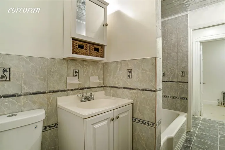 New York City Real Estate | View 477 Decatur Street | Bathroom with tub and laundry hook up | View 10