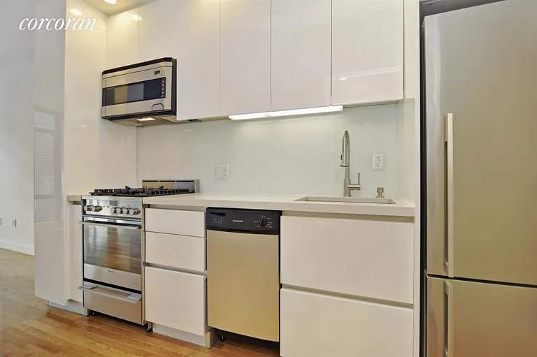 New York City Real Estate | View 148 East 24th Street, 6B | Open kitchen with stainless appliances | View 3