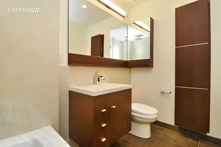 New York City Real Estate | View 148 East 24th Street, 6B | Large bathroom with rainhead shower and storage | View 4