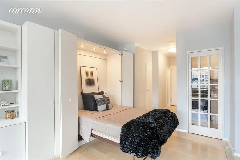 New York City Real Estate | View 300 East 74th Street, 14D | Lighted Murphy bed & French doored Kitchen | View 2