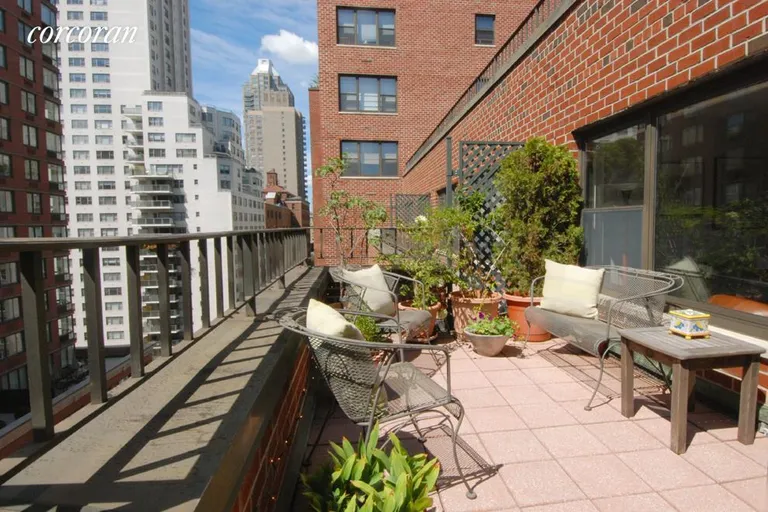 New York City Real Estate | View 301 East 64th Street, 14G | south terrace outside living room
facing west | View 5