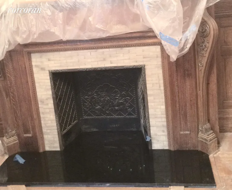 New York City Real Estate | View 67 West 68th Street, Parlor 2B | Black granite adds elegance to fireplace | View 8