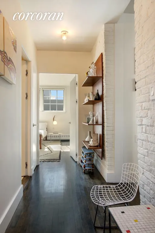 New York City Real Estate | View 130 Beekman Street, 5A | Bedroom wing hall with exposed brick | View 8