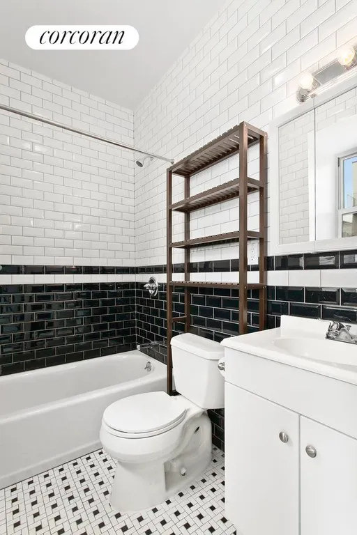 New York City Real Estate | View 69 Maujer Street, 2 FL | Classic subway tiled windowed bathroom | View 6
