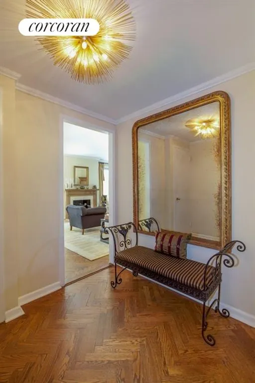 New York City Real Estate | View 15 East 91st Street, 3B | Foyer with beautiful herringbone parquet floor | View 2