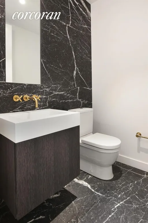 New York City Real Estate | View 325 Henry Street, 3B | Marble Powder Room | View 4