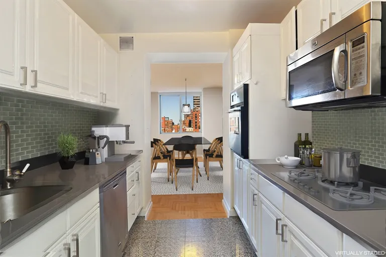 New York City Real Estate | View 170 East 87th Street, W12B | New chef's kitchen with stainless appliances | View 4