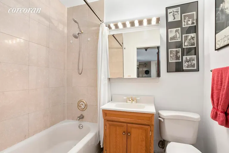 New York City Real Estate | View 1725 York Avenue, 15G | Renovated Bath with Travertine Tiling | View 6