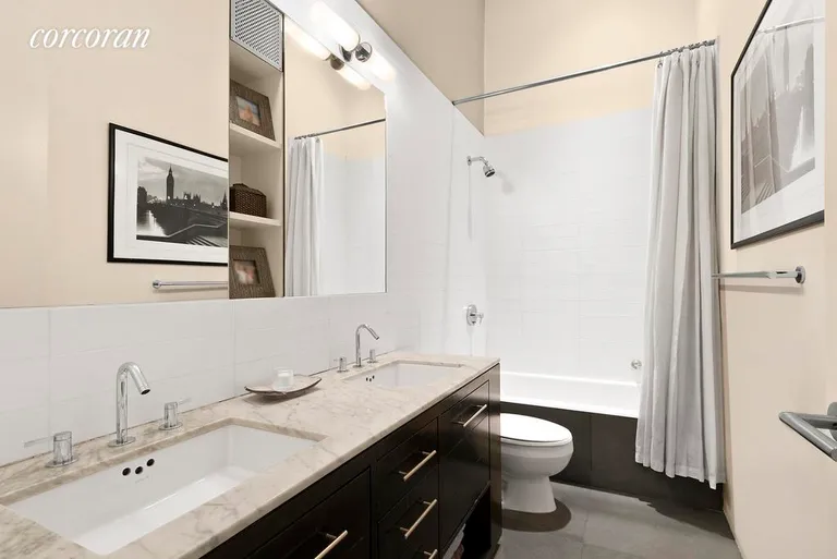 New York City Real Estate | View 77 Bleecker Street, 620 | Double sink custom-made bathroom; carrera marble | View 5