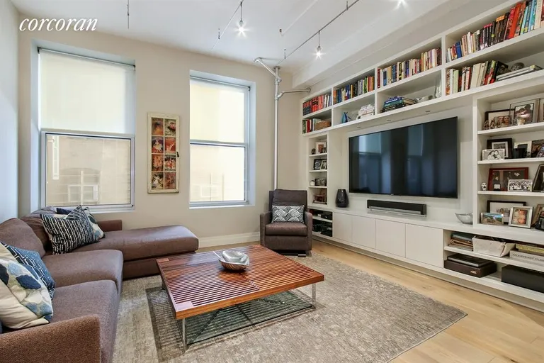 New York City Real Estate | View 107 West 25th Street, 3B | True living room with fantastic built ins | View 2