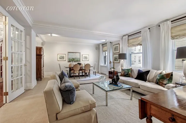 New York City Real Estate | View 150 East 73rd Street, 7D | Living Room and Dining Room Framed by French Doors | View 2