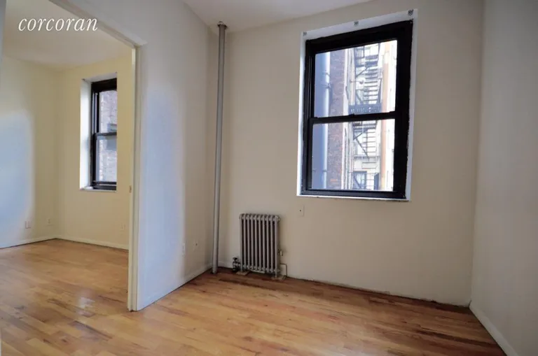 New York City Real Estate | View 202 Thompson Street, 7 | Rear bedroom | View 2