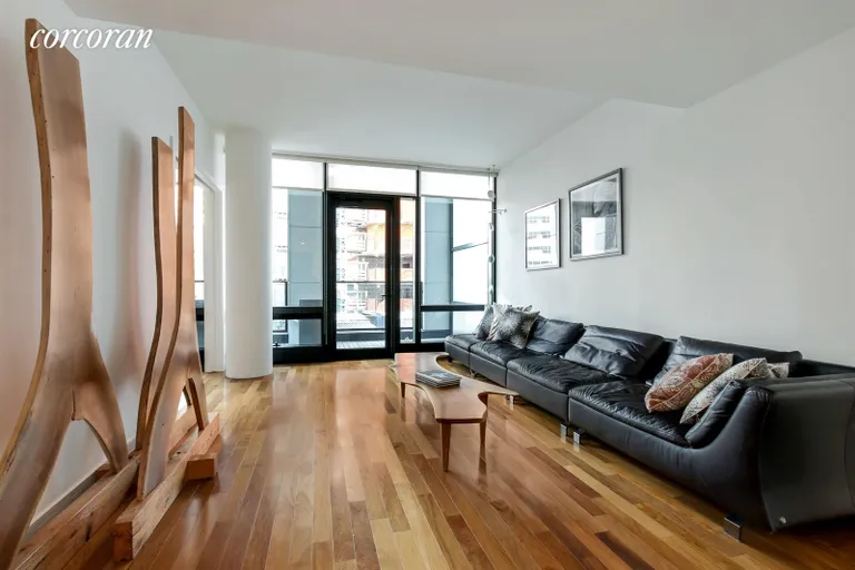 New York City Real Estate | View 101 Warren Street, 7J | Living Room Opens to Enormous Terrace | View 2