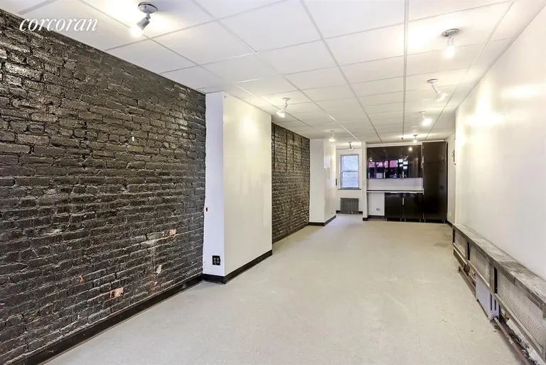 New York City Real Estate | View 183 Avenue B | Beautiful exposed brick and powder room in retail | View 3