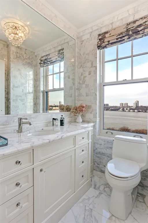 New York City Real Estate | View 33 Riverside Drive, 13AB | Powder room with river views | View 17