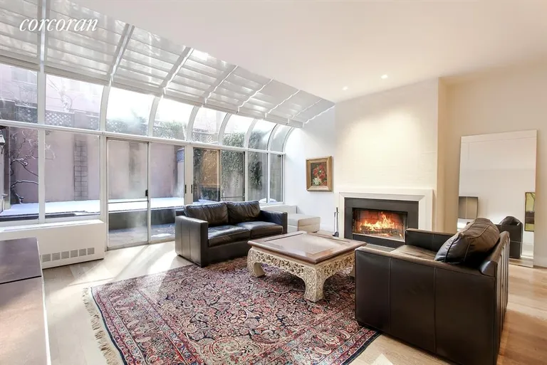 New York City Real Estate | View 107 West 89th Street, GB | Sunny Living Room with Solarium Wall | View 2
