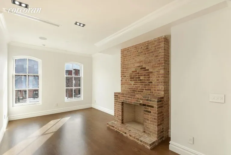 New York City Real Estate | View 861 Lafayette Avenue | Sun Drenched Living Room with Working Fireplace | View 15
