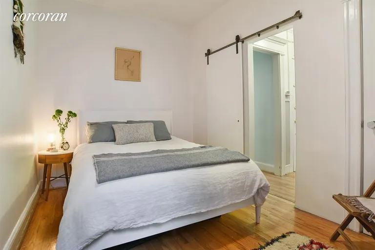 New York City Real Estate | View 226 Saint James Place, 1R | Master bedroom with sliding barn door | View 2