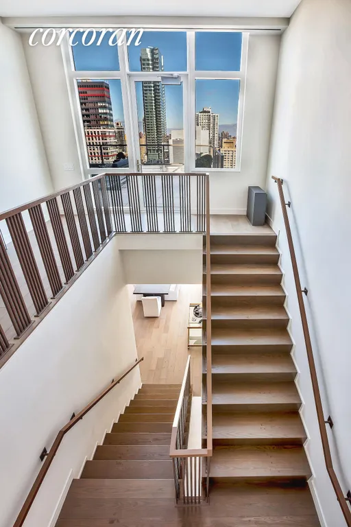 New York City Real Estate | View 305 East 51st Street, PHB | Grand Staircase | View 13