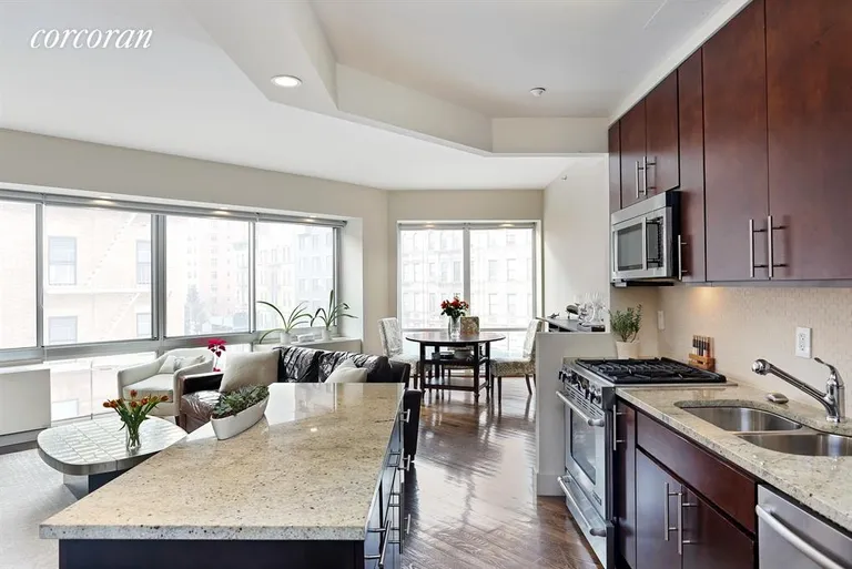 New York City Real Estate | View 2110 Frederick Douglass Blvd, 4B | Open kitchen with striking island | View 2