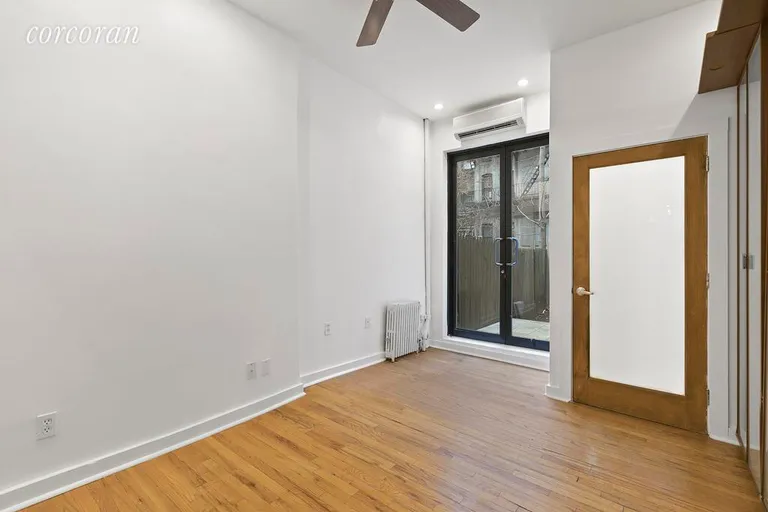 New York City Real Estate | View 208 East 90th Street, 1E | Master bedroom with patio doors | View 7