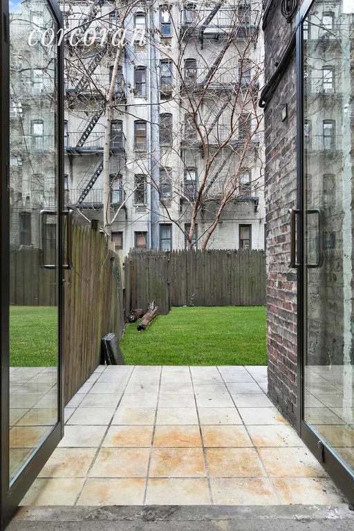 New York City Real Estate | View 208 East 90th Street, 1E | Private patio off MBR that leads to common garden | View 10