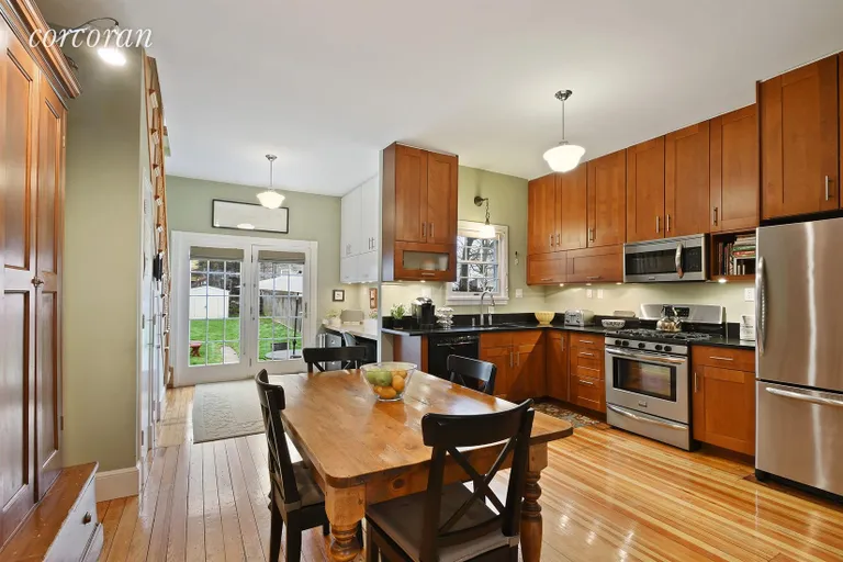 New York City Real Estate | View 211 Vanderbilt Street | Kitchen/Dining Room with office nook in the rear | View 2