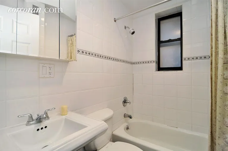 New York City Real Estate | View 801 Riverside Drive, 3H | White tiled bath with window. | View 4