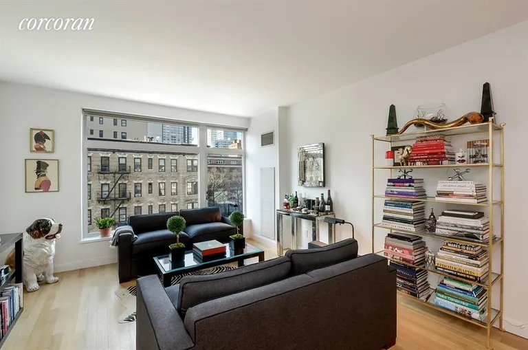 New York City Real Estate | View 400 East 67th Street, 5C | Living Room overlooks First Avenue | View 2