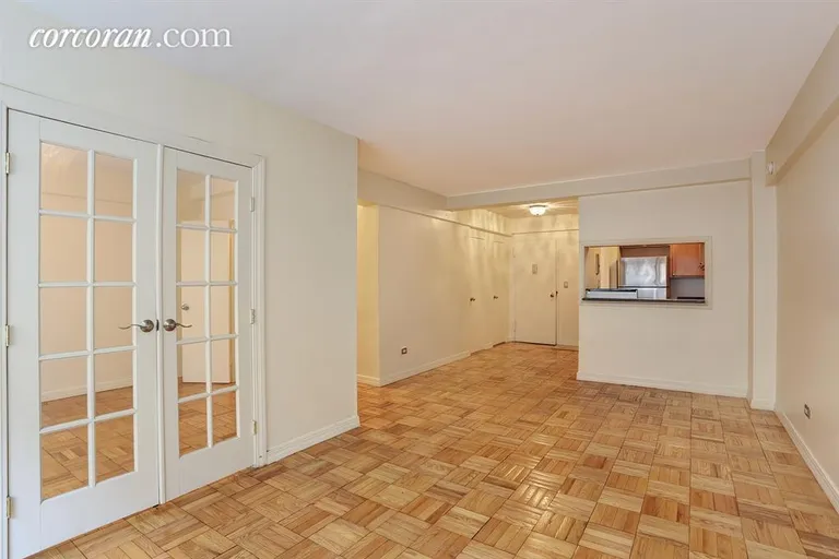 New York City Real Estate | View 333 East 46th Street, 2F | Living Room, Dining Area, French Doors to Bedroom | View 2