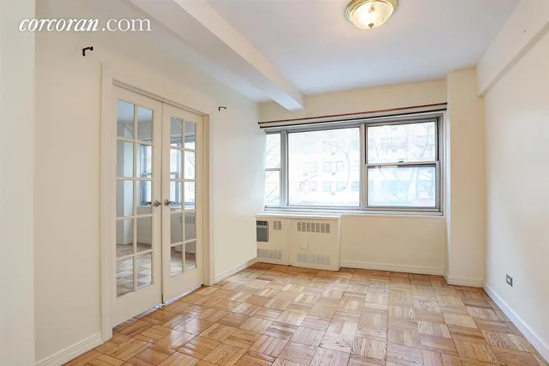 New York City Real Estate | View 333 East 46th Street, 2F | Bedroom with French Doors to Living Room | View 3