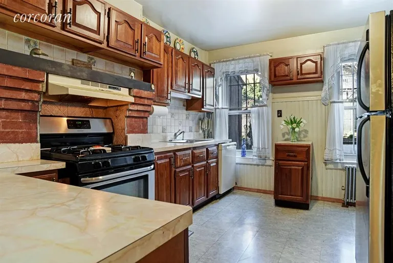 New York City Real Estate | View 345 Gates Avenue | Renovated Kitchen w/ direct access to garden | View 7