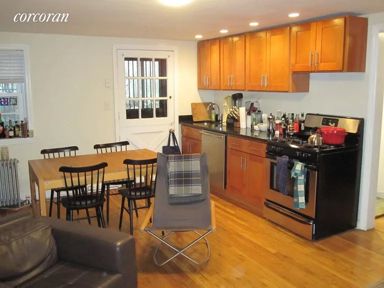 New York City Real Estate | View 433 State Street, 1 | Open Kitchen to Dining Area and Door to Patio | View 2