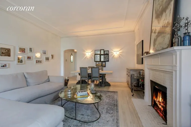 New York City Real Estate | View 25 Remsen Street, 4 | Living room with wood burning fireplace | View 2