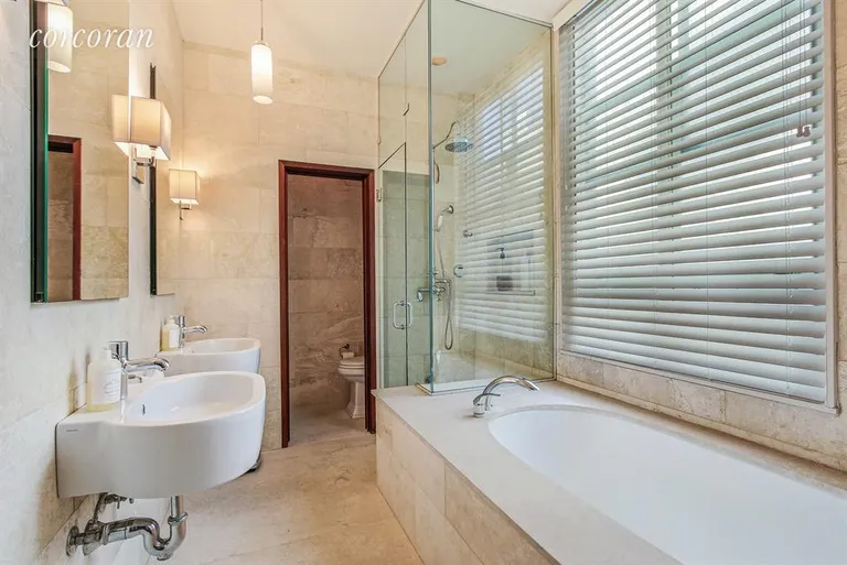 New York City Real Estate | View 684 Broadway, 9E | Travertine Spa-Like Master Bathroom | View 7