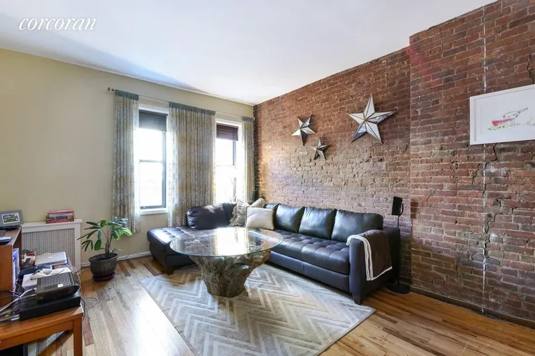 New York City Real Estate | View 333 East 92nd Street, 4B | Warm exposed brick and steady north light | View 2