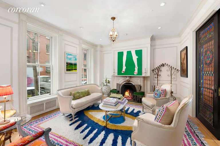 New York City Real Estate | View 48 West 10th Street | Charming Parlor with Wood Burning Fireplace | View 2
