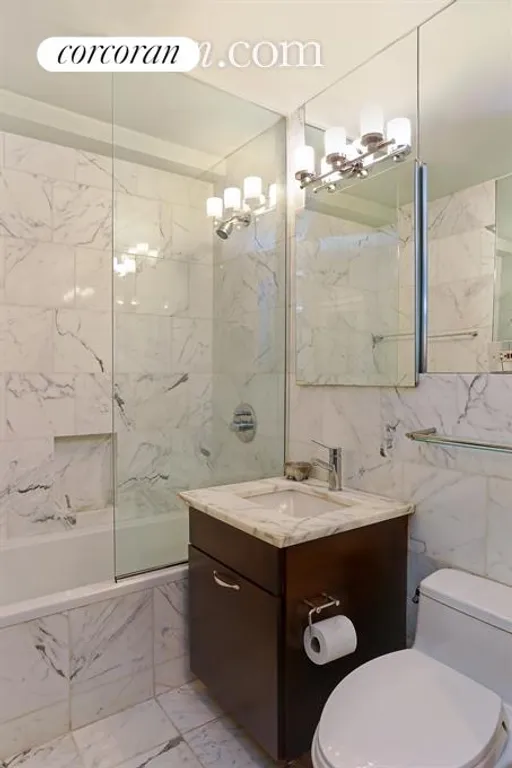 New York City Real Estate | View 225 East 57th Street, 1Q | Exquisite Marble Bathroom | View 6