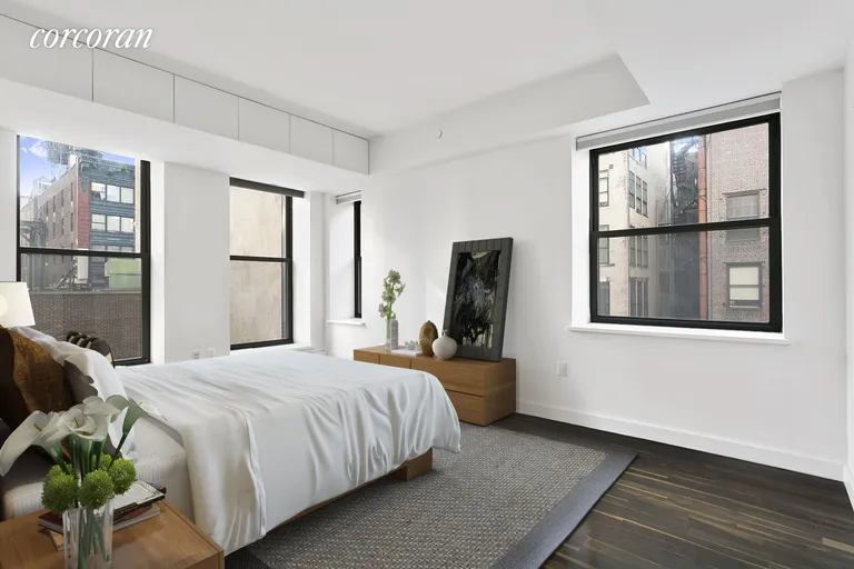 New York City Real Estate | View 36 East 22nd Street, 7 | Master Bedroom with ensuite bathroom | View 3