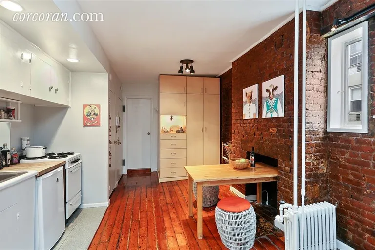 New York City Real Estate | View 88 East 3rd Street, 9 | Kitchen and Dining with decorative Fire Place | View 3