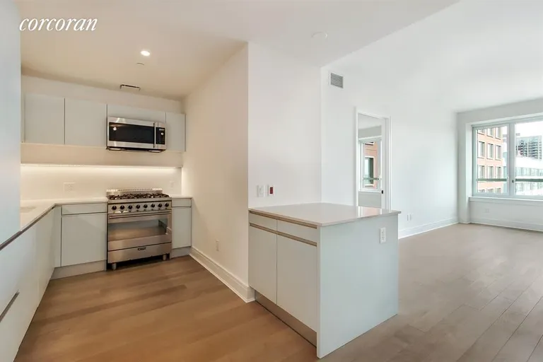 New York City Real Estate | View 265 State Street, 1105 | Open kitchen with island towards the living room  | View 4