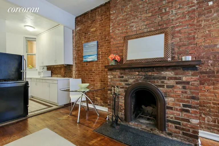 New York City Real Estate | View 237 East 12th Street, A | Exposed Brick & Decorative Fireplace | View 2