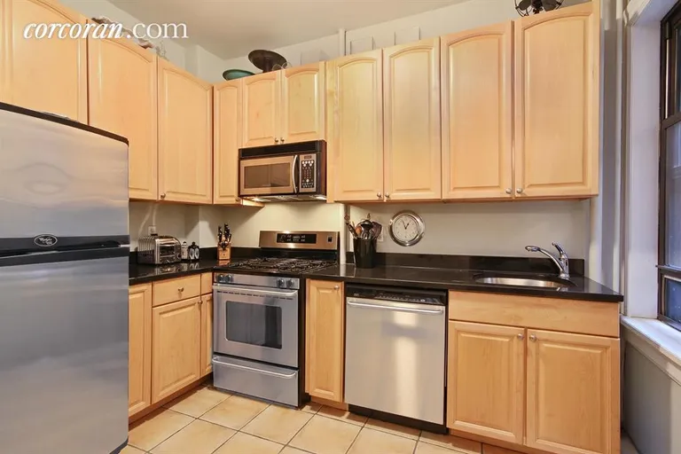 New York City Real Estate | View 245 West 74th Street, 1F | Renovated windowed kitchen with granite counters | View 2