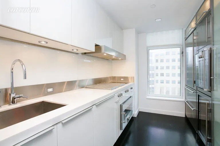 New York City Real Estate | View 400 East 67th Street, 6J | Windowed modern kitchen with high-end appliances | View 4