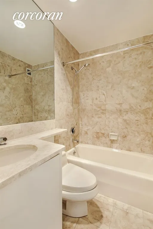 New York City Real Estate | View 100 United Nations Plaza, 15G | Ensuite Marble Bathroom in 2nd Bedroom | View 8